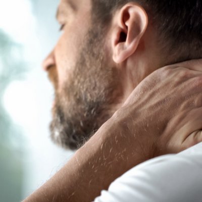 Man holding his neck in pain